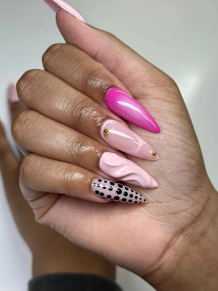 Almond set mixing hot pink, a sculpted wave, black polka dots and gold studs